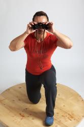 ANGELINA KNEELING POSE WITH SPYGLASS